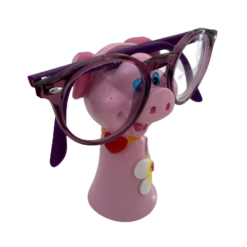En lyserød brilleholder, der forestiller en gris med briller.